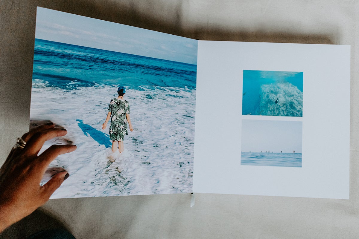 Signature Layflat Album opened to series of coastal scenes