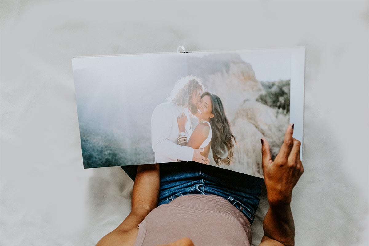 Signature Layflat Album opened to two-page panoramic spread of bride and groom