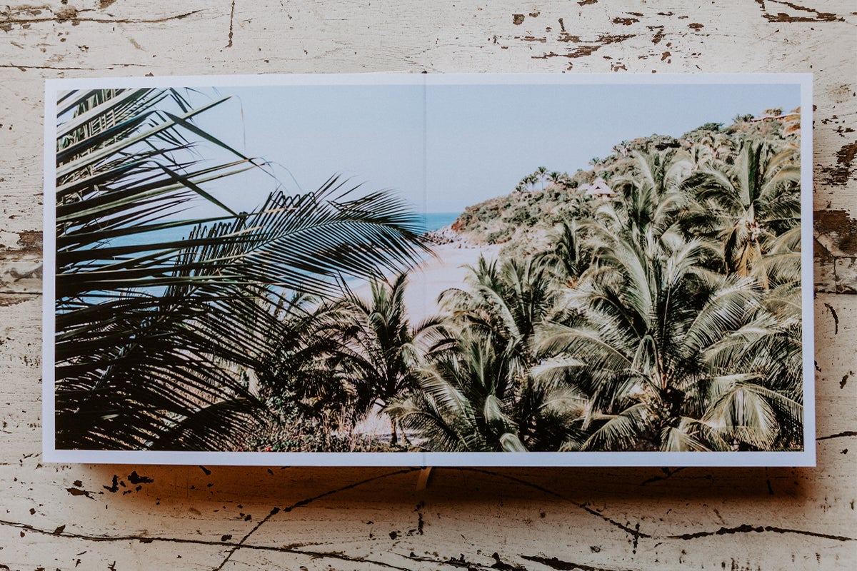 Signature Layflat Album opened to two-page panoramic image of beautiful coastline