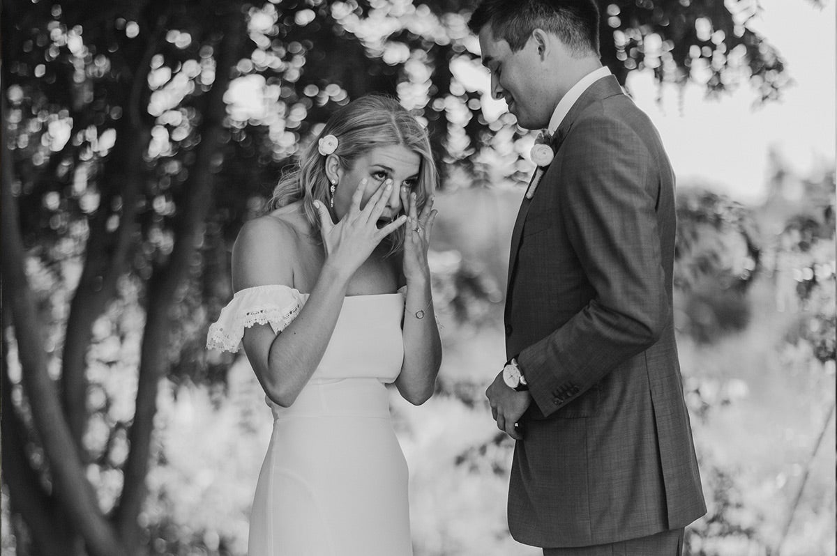 Bride tearing up as she sees groom for the first time before ceremony