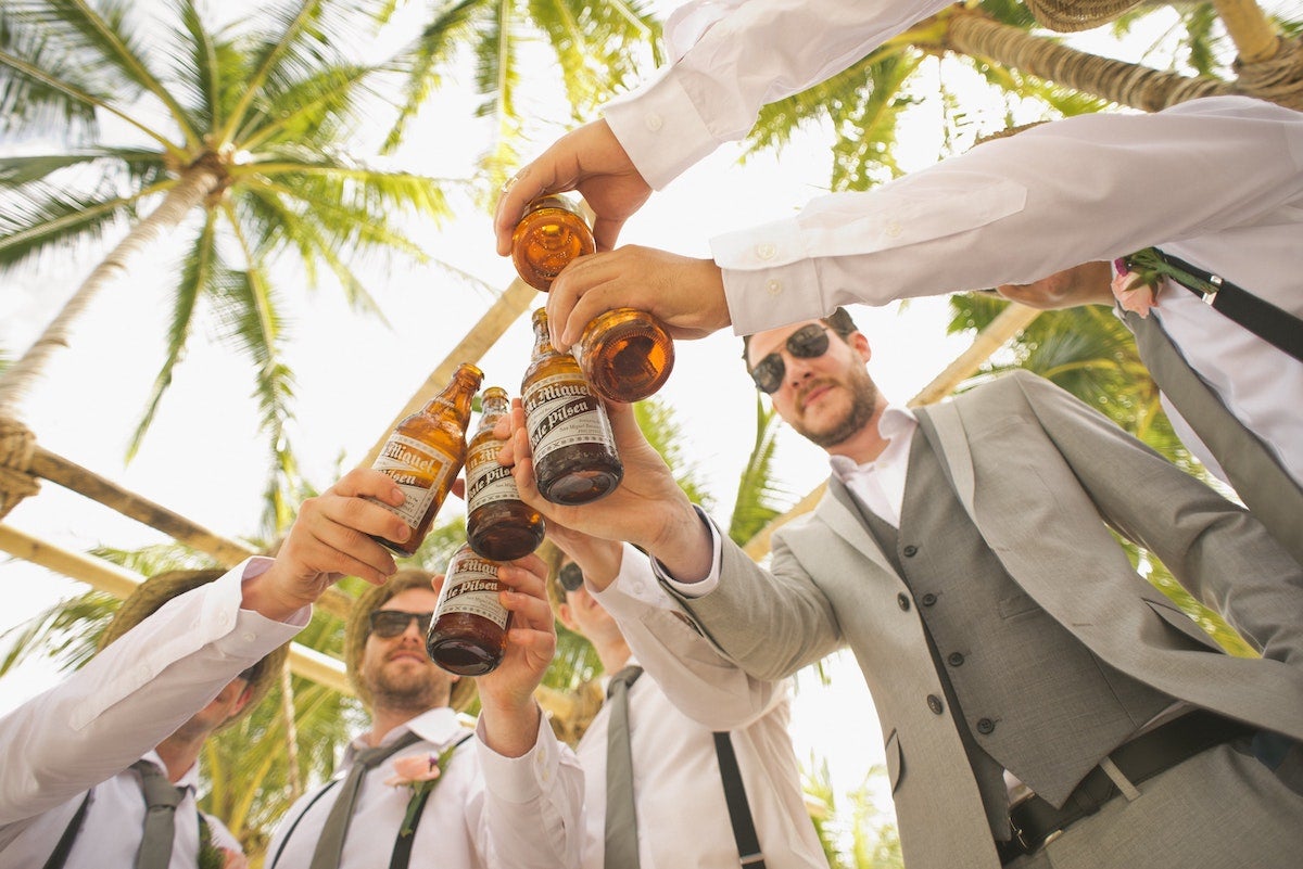 Groomsmen sharing a toast before the ceremony