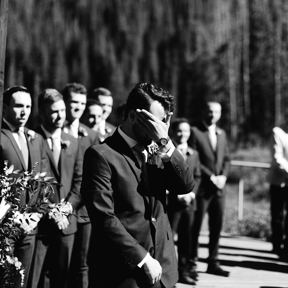 Groom tearing up as he watches bride enter the ceremony