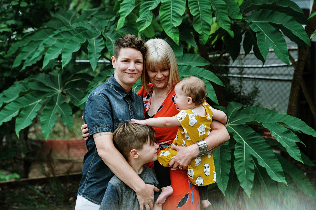 Family portrait with lush green backdrop