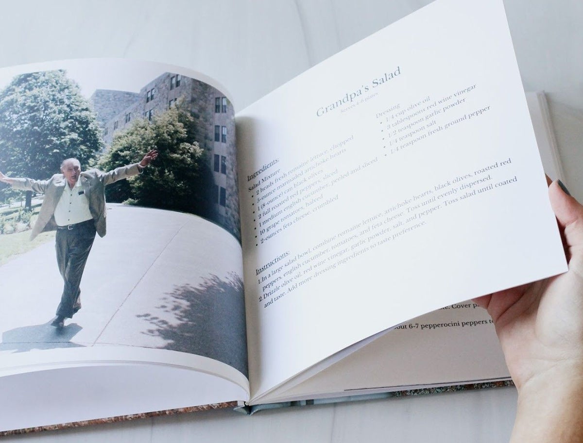 Artifact Uprising Photo-Wrapped Hardcover Book opened to recipe for Grandpa’s famous salad with photo of grandpa next to the recipe