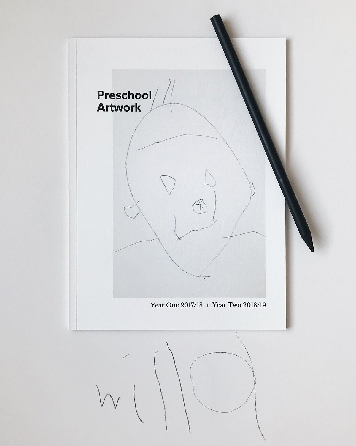 Artifact Uprising Softcover Photo Book featuring child's drawing and titled Preschool Artwork