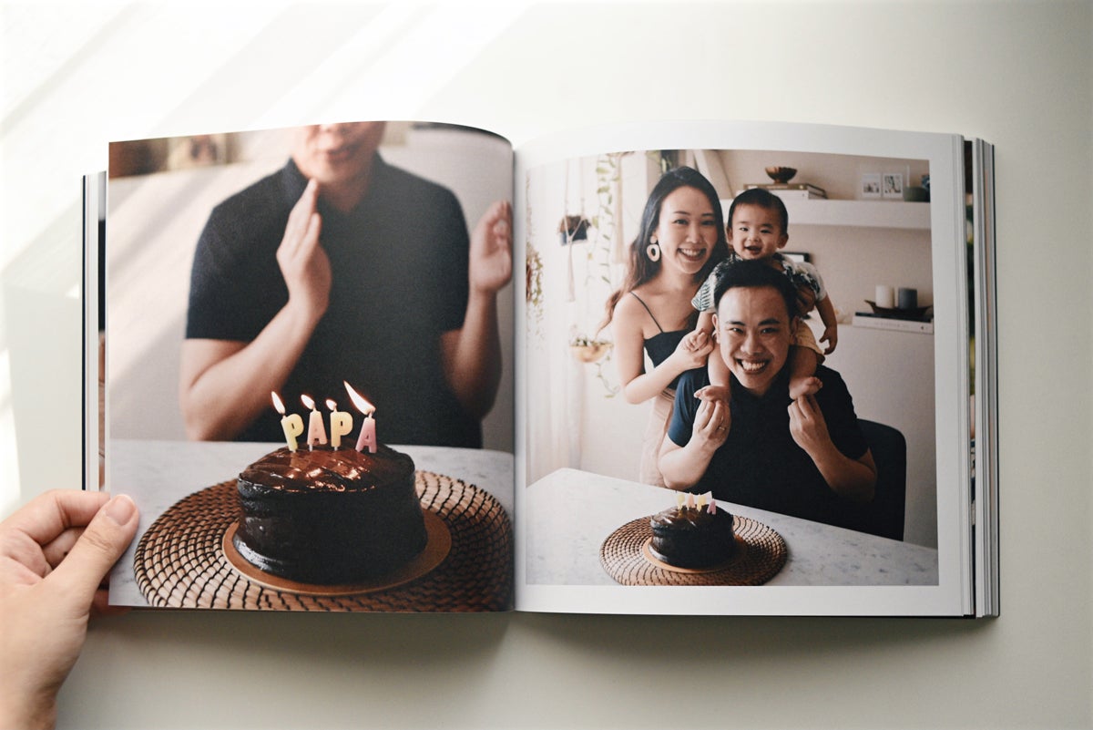 Artifact Uprising Color Series Photo Book opened up to family photos from dad's birthday