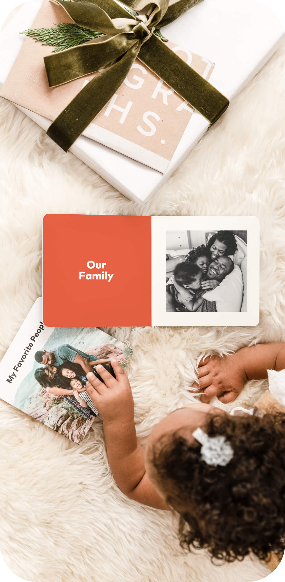 Edited photo of family snuggling on bed printed in Artifact Uprising Baby Board Book