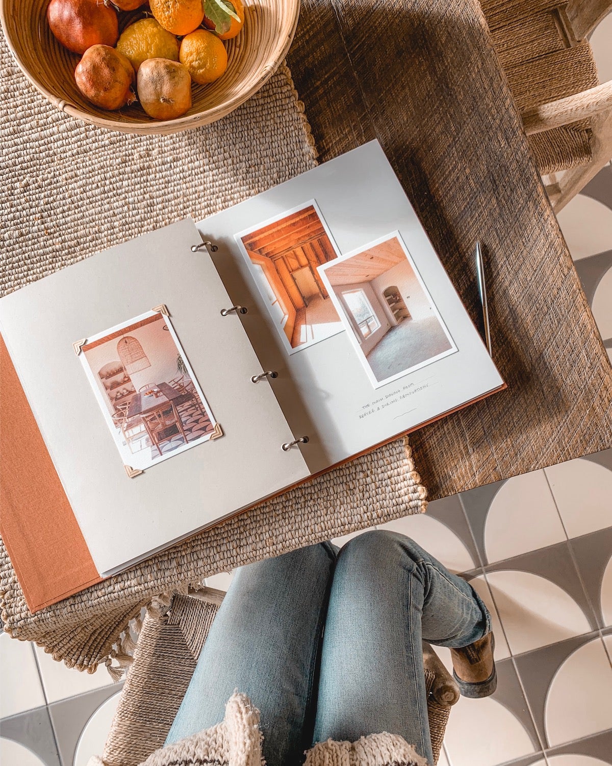 Artifact Uprising Scrapbook Album on dining table at the Joshua Treehouse and opened to renovation photos