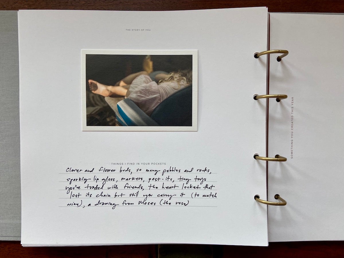 Open Story of You Early Years Book with handwritten note and appended photo print on page