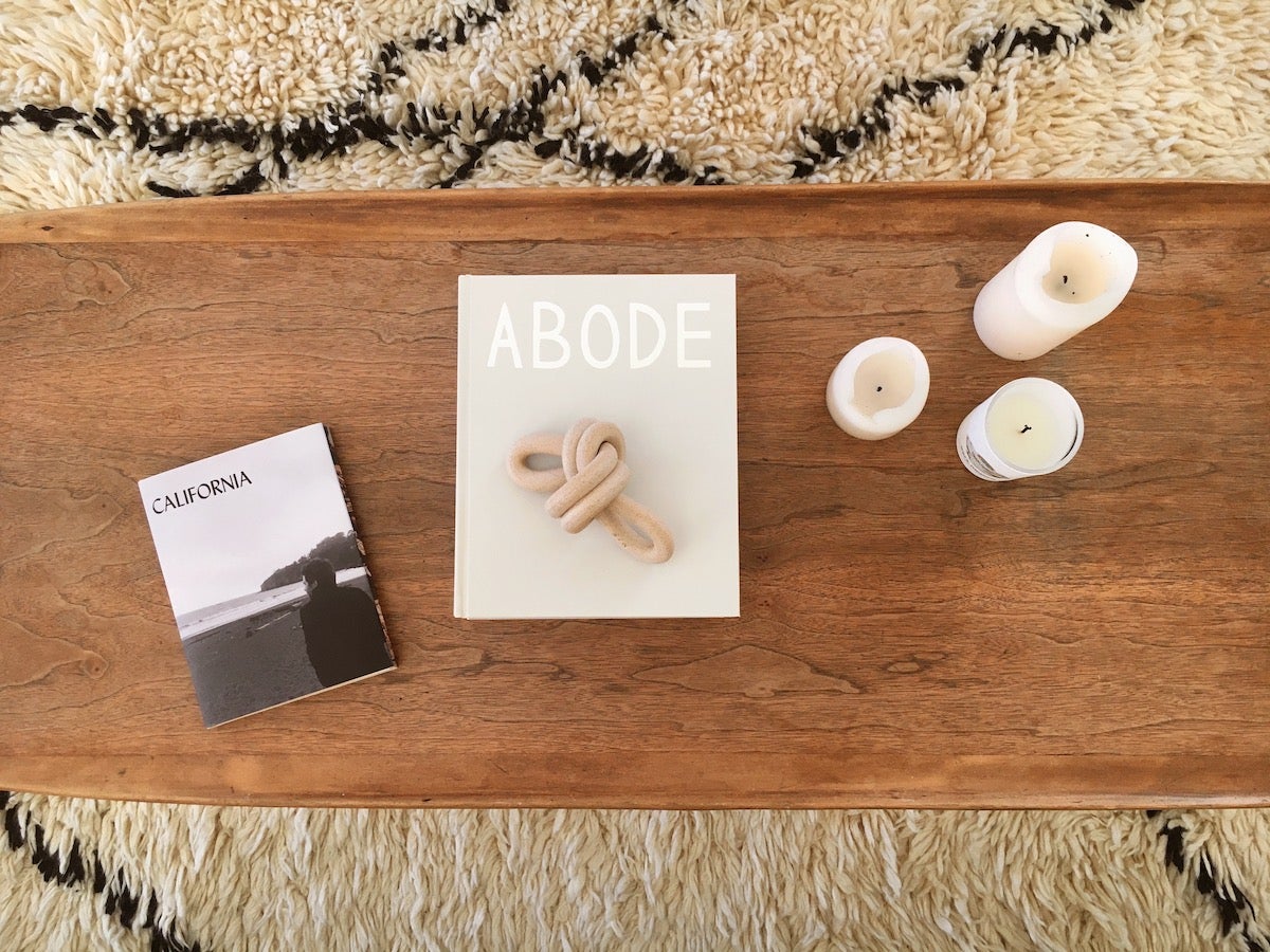 Photo book of California pictures sitting on a wooden coffee table