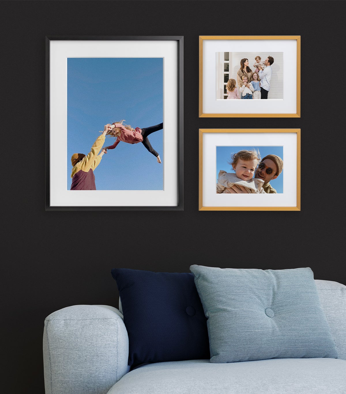 Artifact Uprising Modern Metal Frames featuring family photos arranged in small gallery wall above blue couch