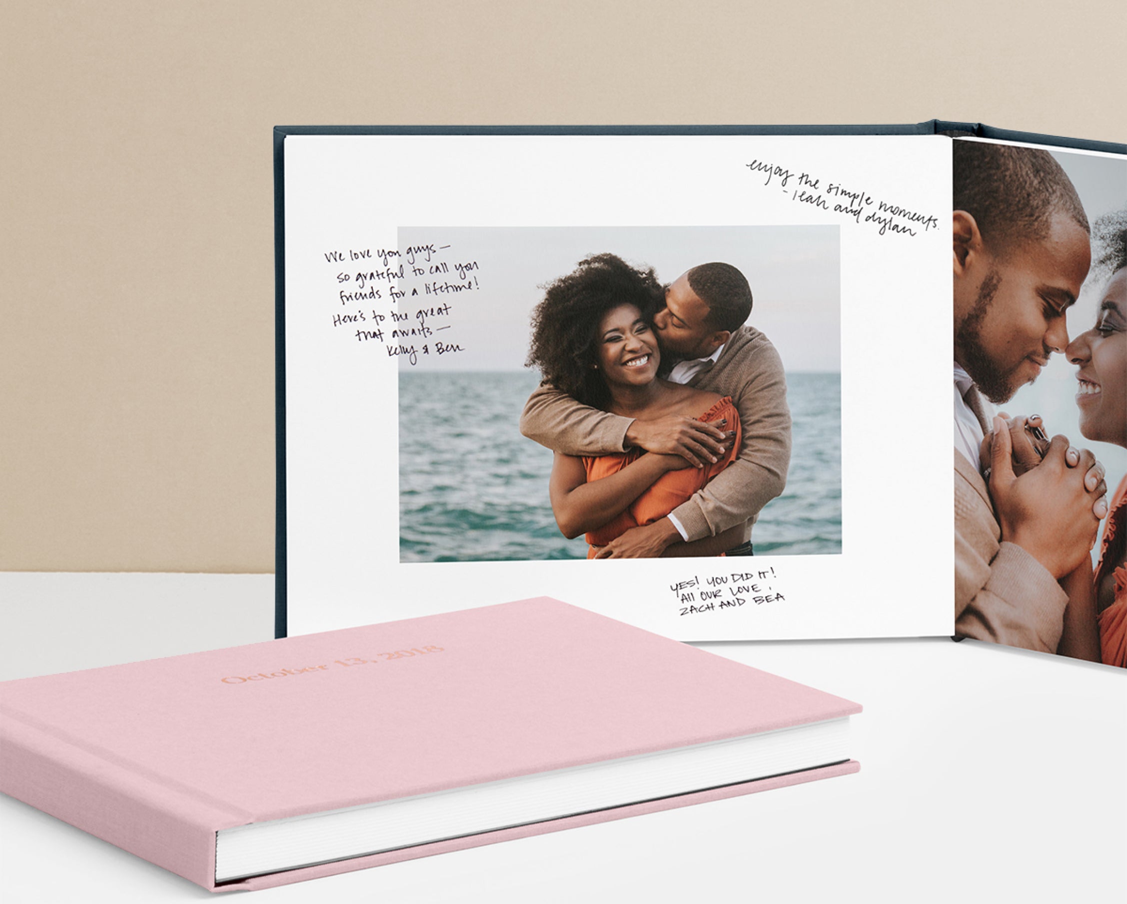Artifact Uprising Wedding Guest Book opened to engagement photo surrounded by notes from friends and family