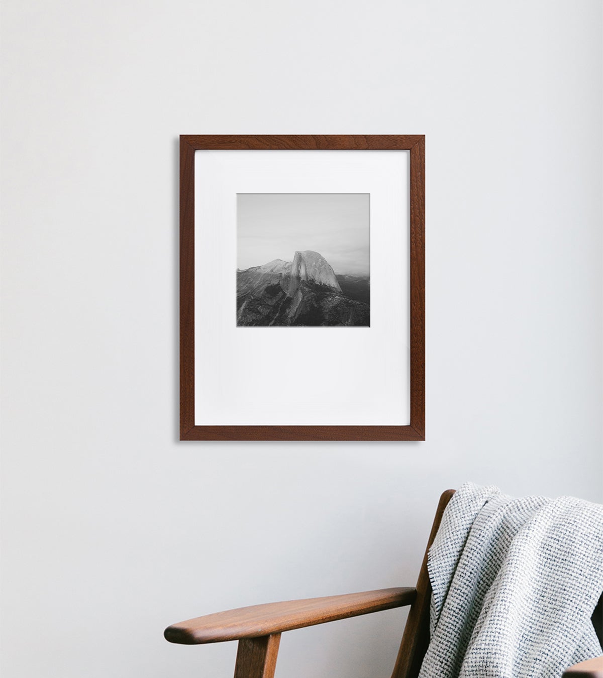 Black and white photo of mountain landscape matted to a 10 inch square inside a 16 x 20 inch Walnut Artifact Uprising Gallery Frame