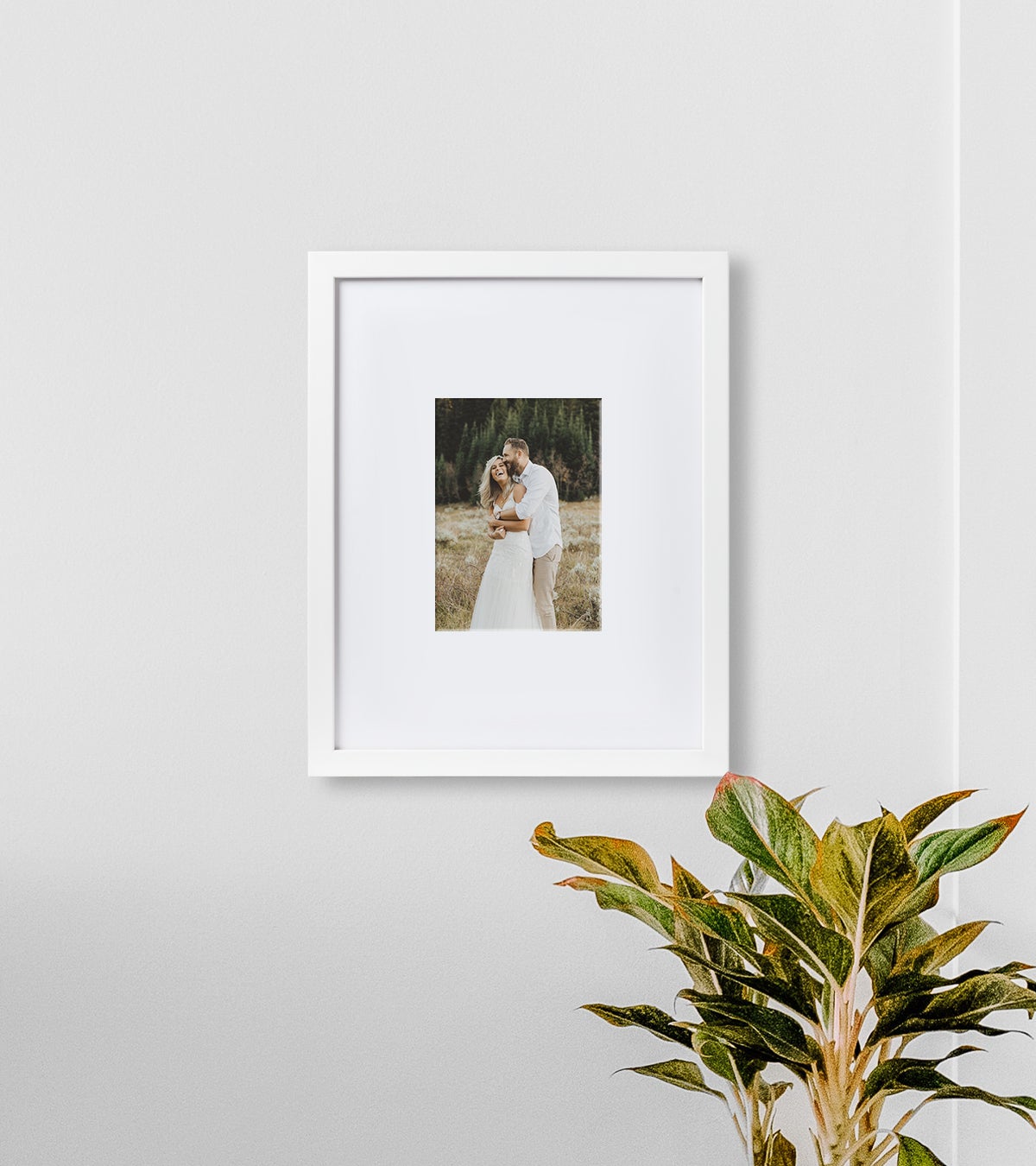 Engagement photo of couple set in mountain landscape matted to a 5 inch square in a white 14 x 11 inch Artifact Uprising Gallery Frame