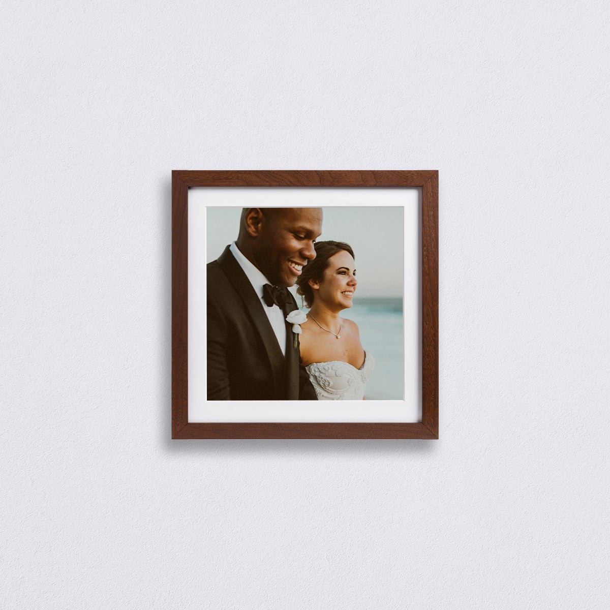 Close-cropped wedding photo of couple matted to 10 inch square inside a walnut 12 x 12 inch Gallery Frame