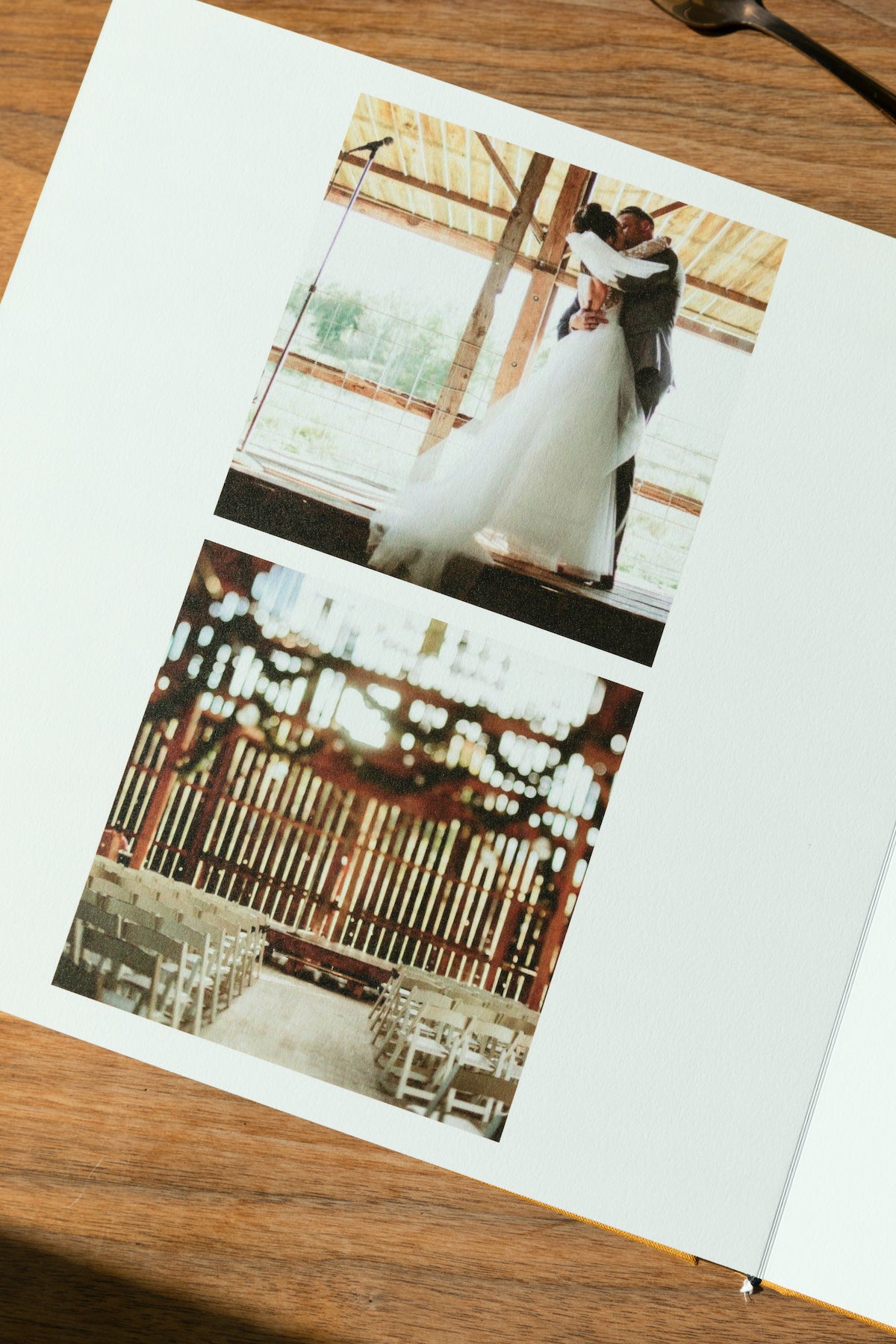 Artifact Uprising Layflat Photo Album opened to wedding photos on left page