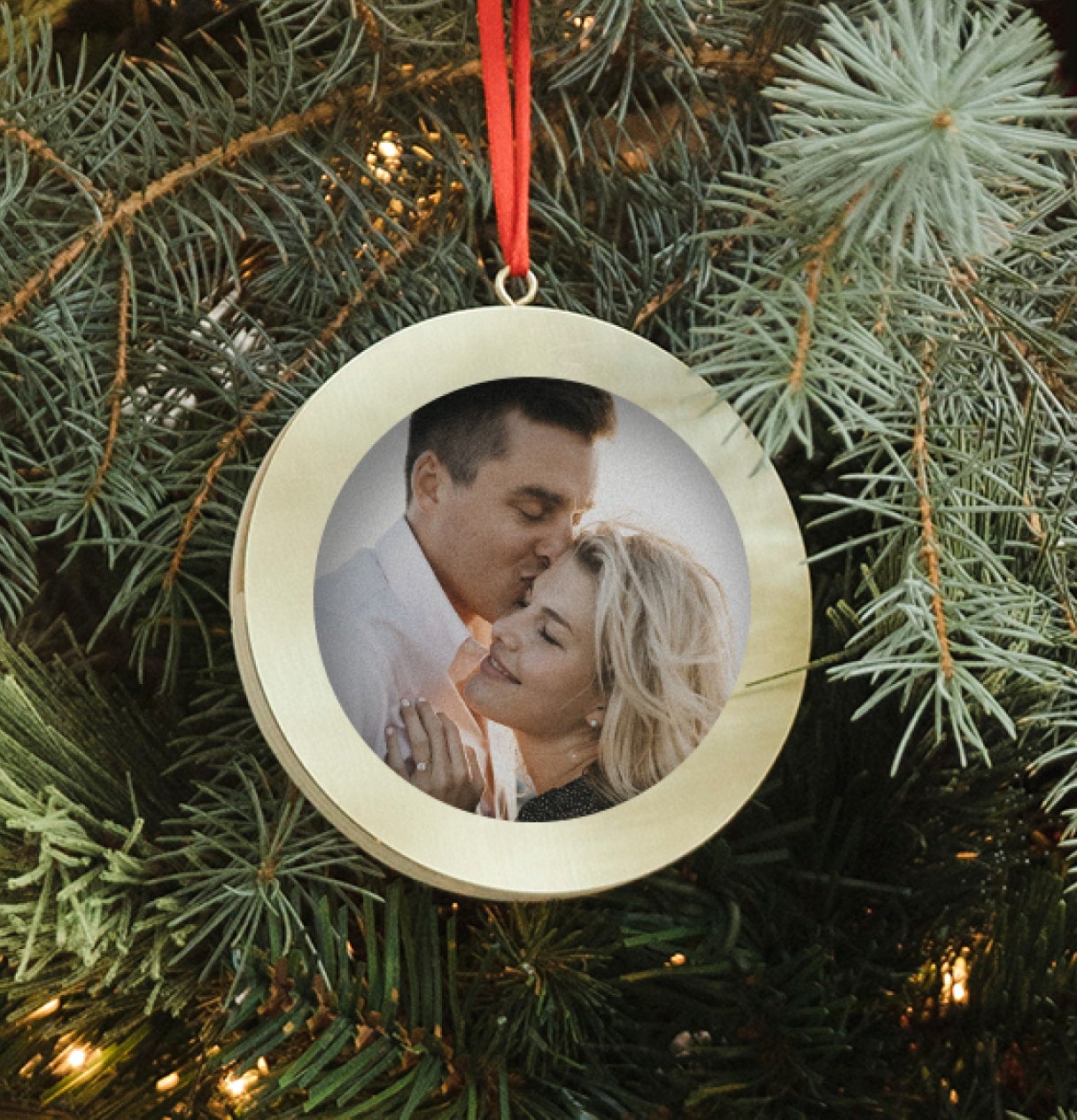 Photo ornament hung on Christmas Tree