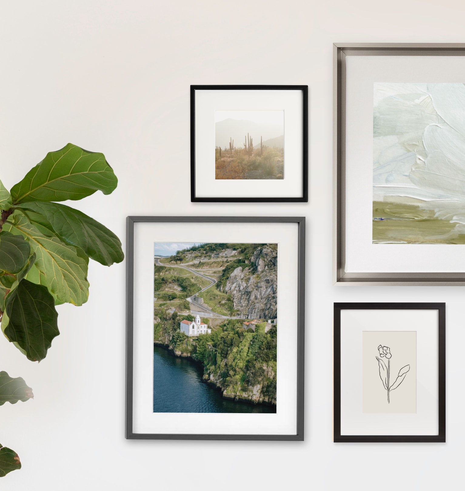 Four metal frame gallery wall with mix of landscape and art prints