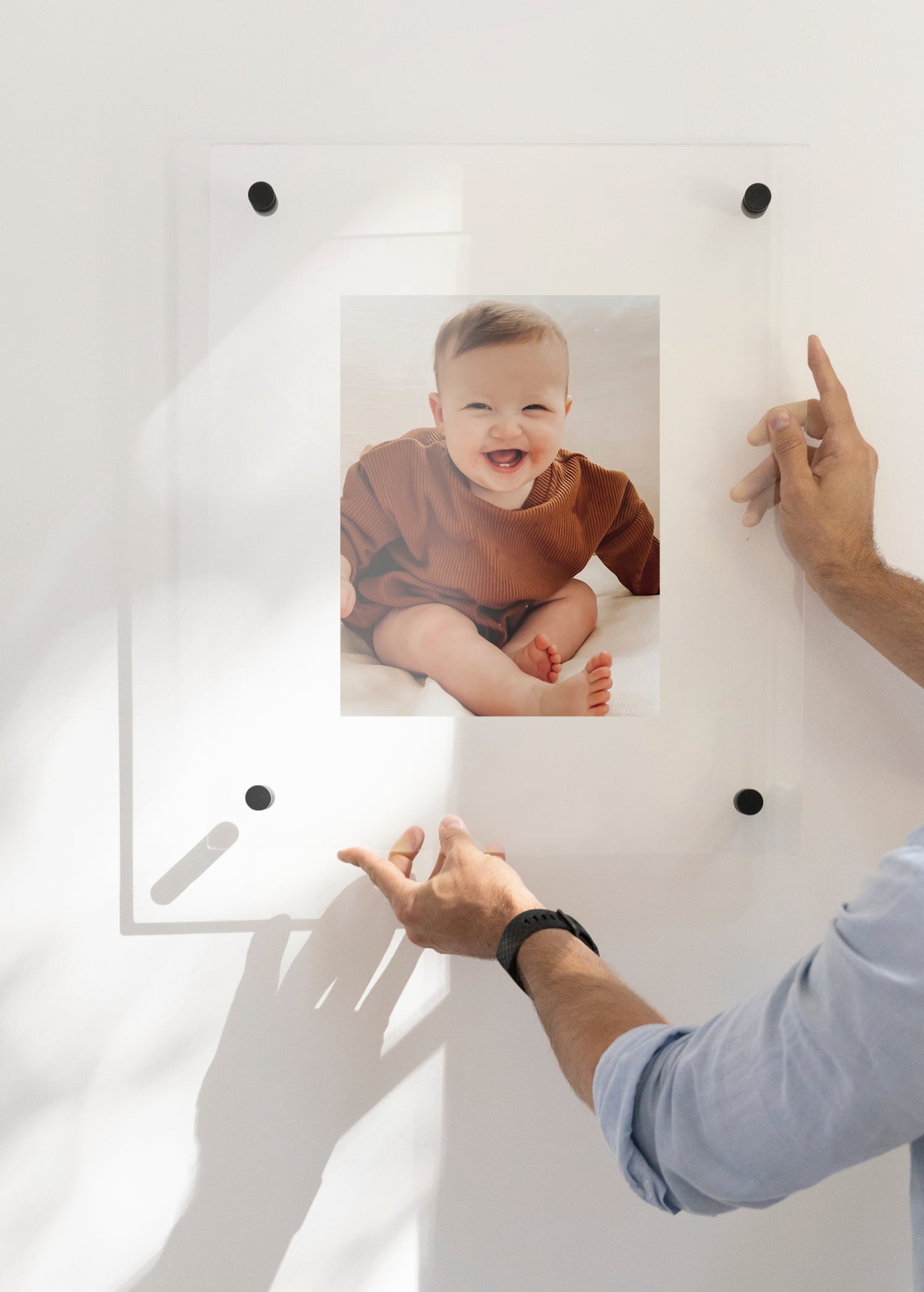 Floating Frame featuring black finishing showcasing laughing baby image