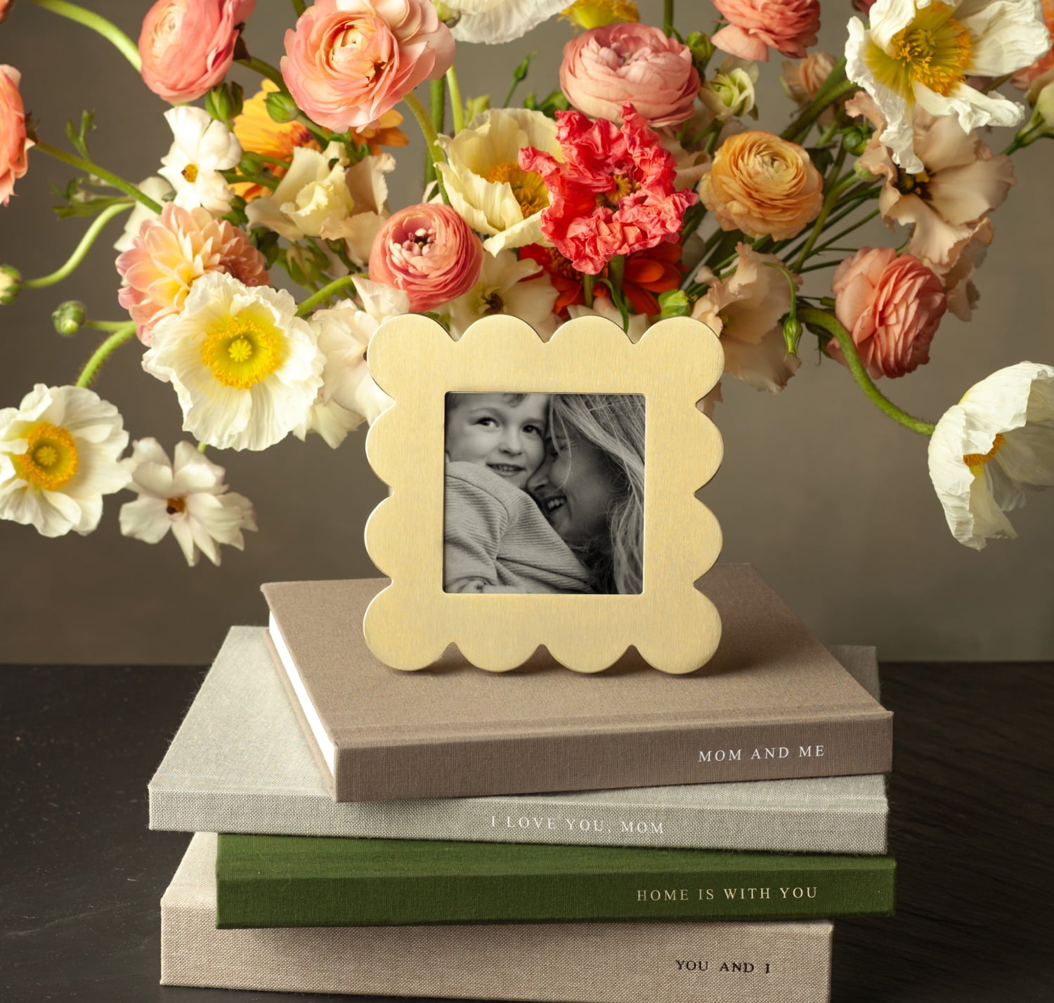scallop tabletop frame displayed on top of stacked book