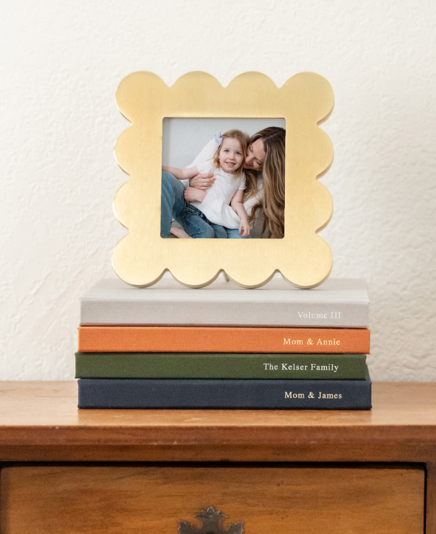 Scallop Frame displayed on a stack of photo books
