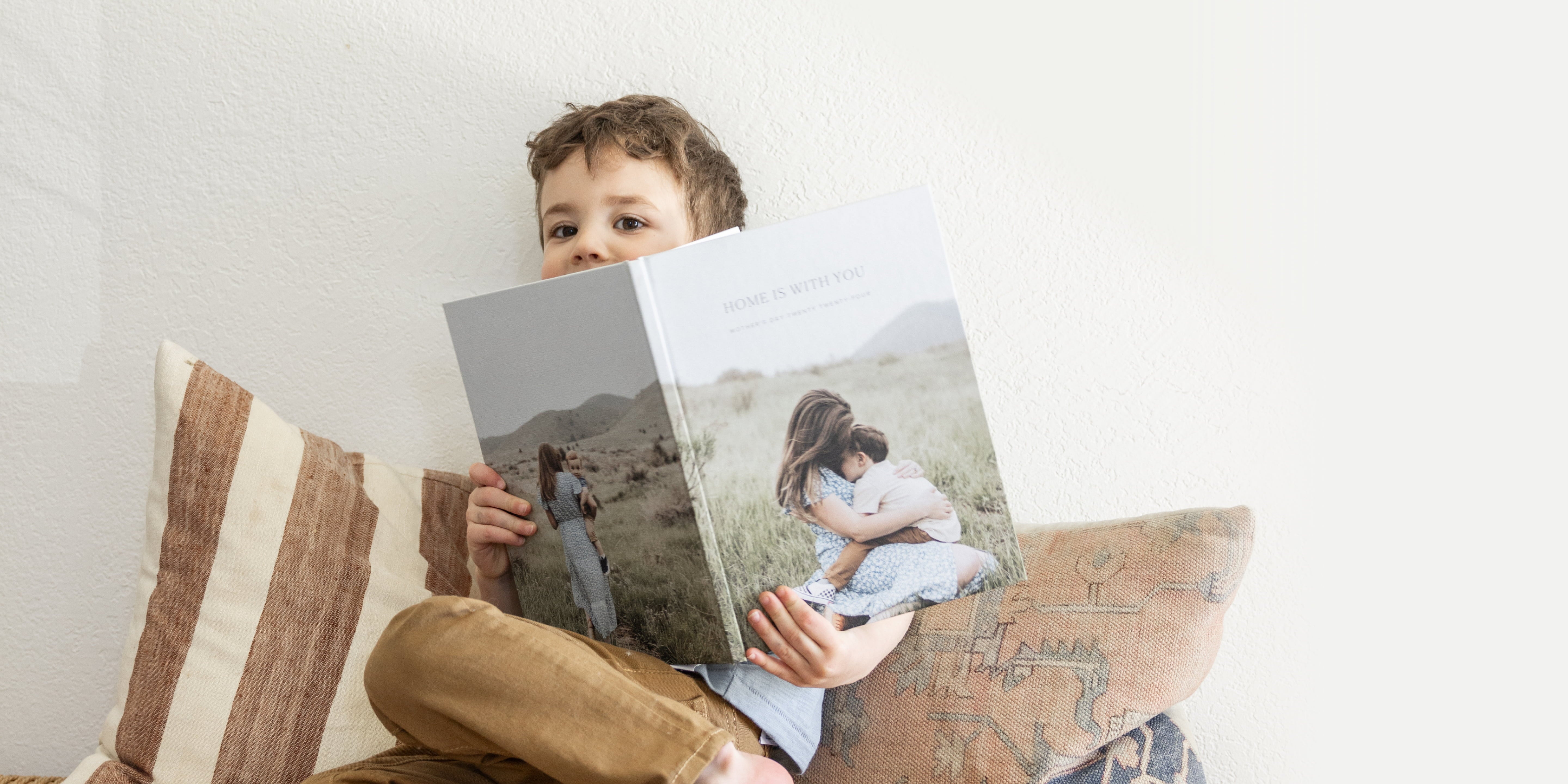 child looking through our photo-wrapped hardcover