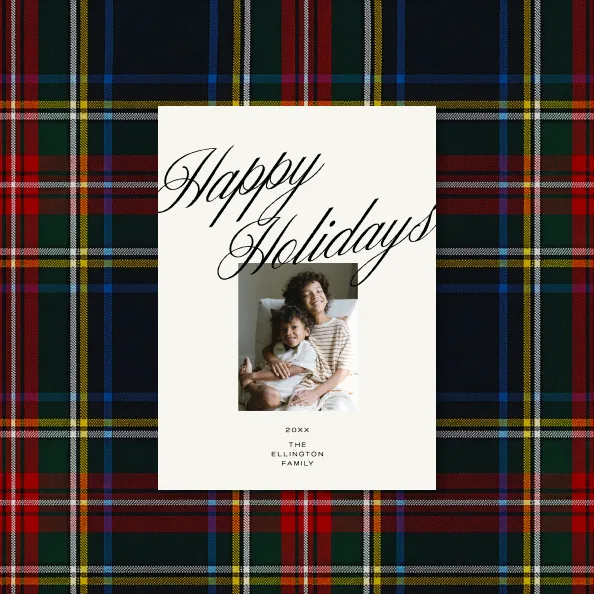 A personalized holiday card on tartan fabric