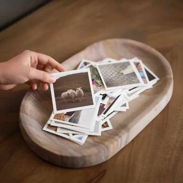 A hand holding photo prints