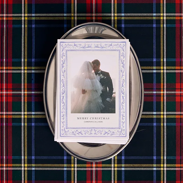 Merry Christmas holiday card on a silver tray over plaid