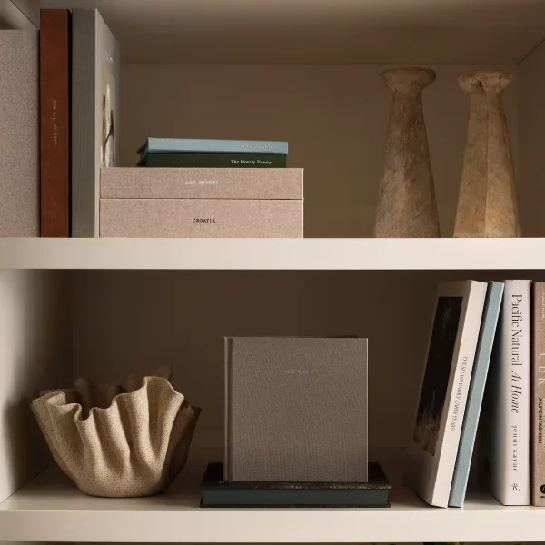 Photo books displayed on a shelf