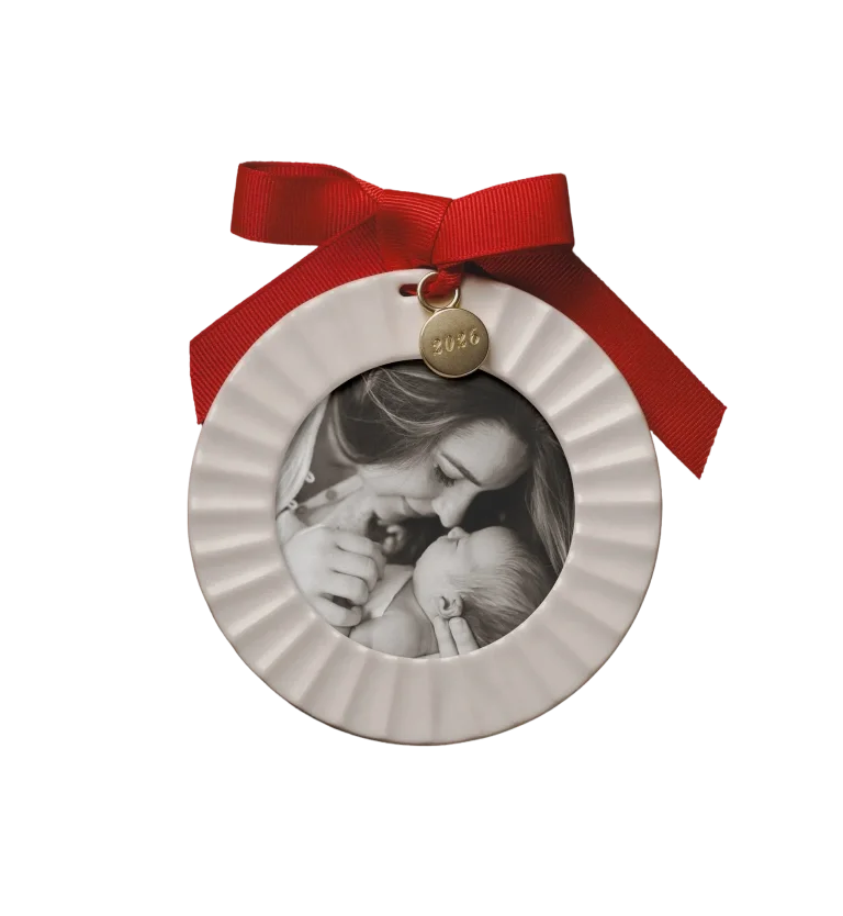 Fluted porcelain photo ornament with a red ribbon