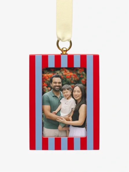 A family photo in a striped wood ornament