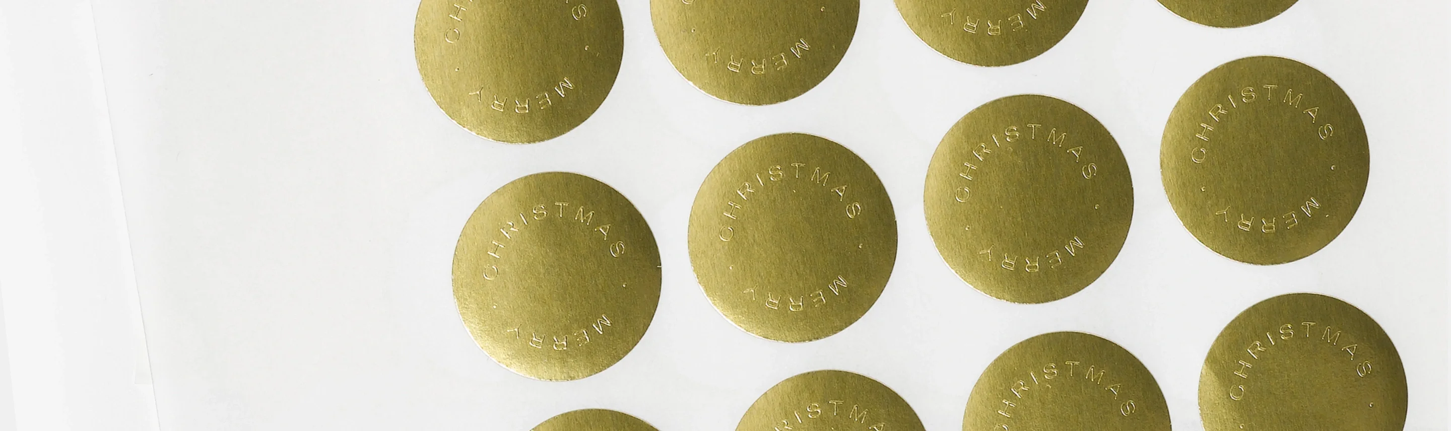 Foil-stamped envelope seals styled with holiday stationery