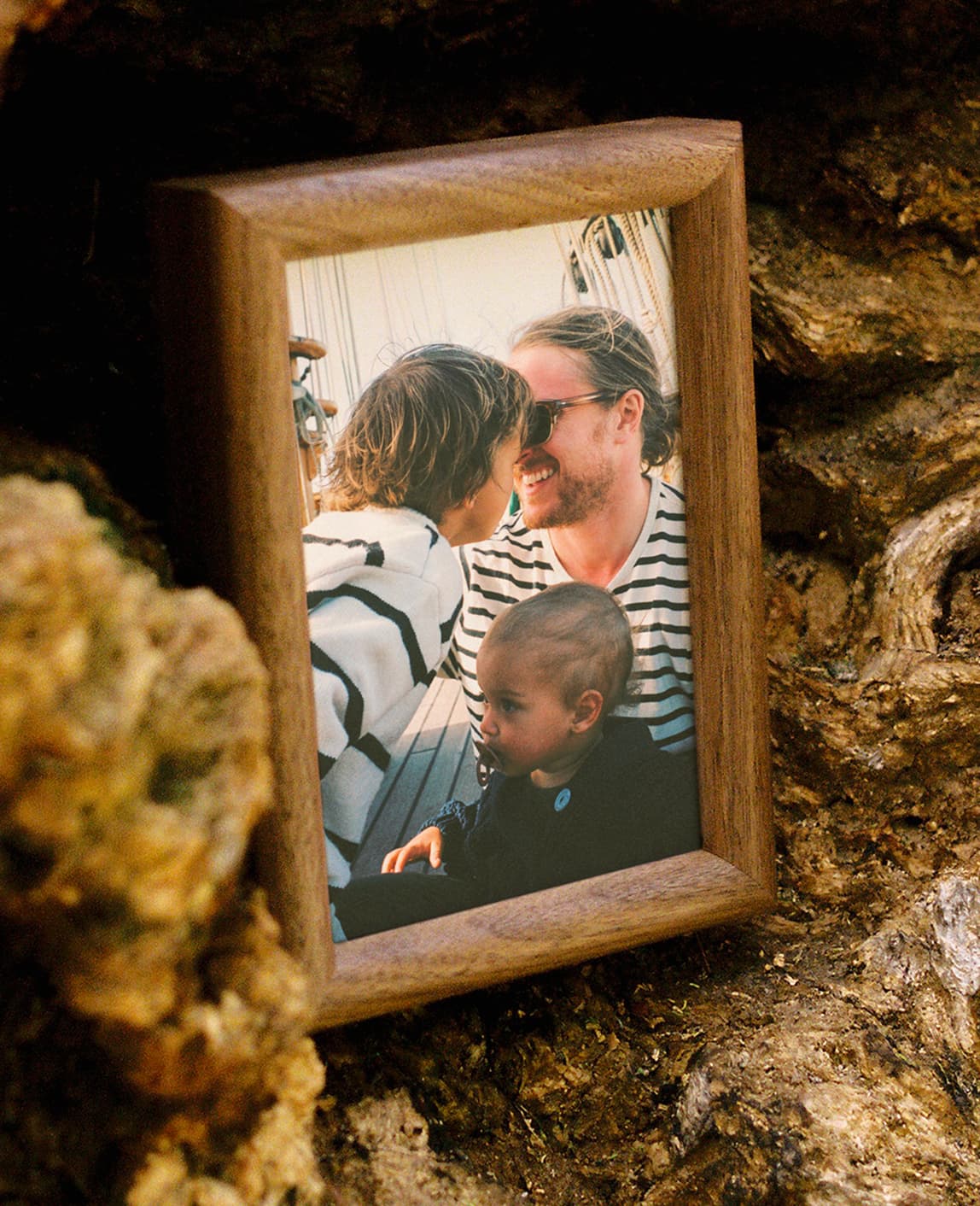 Wood frame with a family photo outdoors