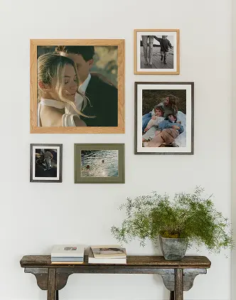 Gallery wall featuring multiple frames creating a curated gallery wall.