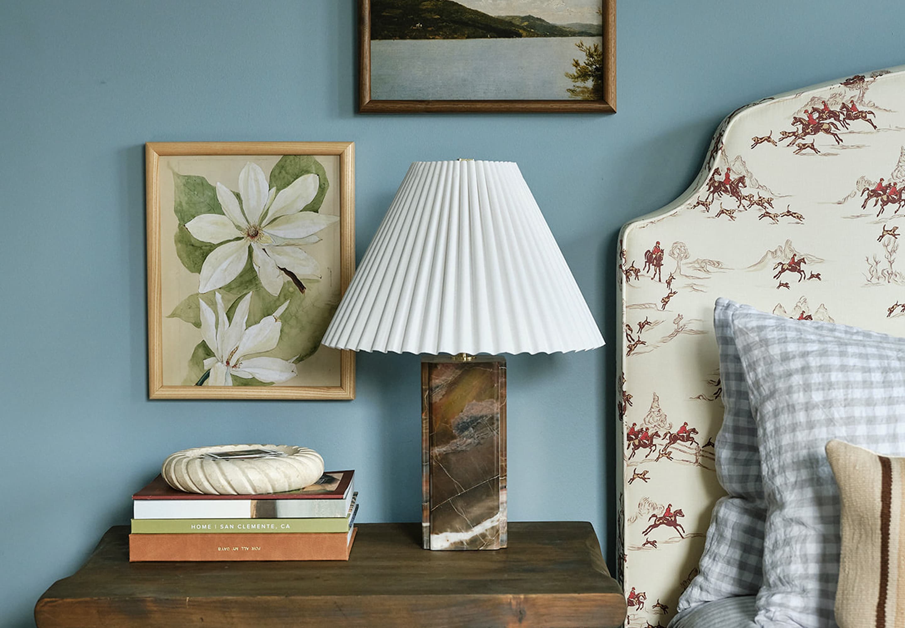 Banister Wood Frames in Oak Finish and book stack, in home bedroom.
