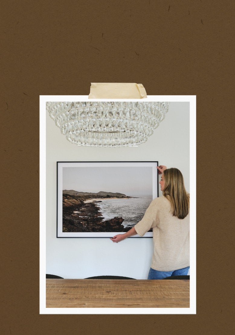 Modern Metal Frame in Black Finish, being hung up on wall.