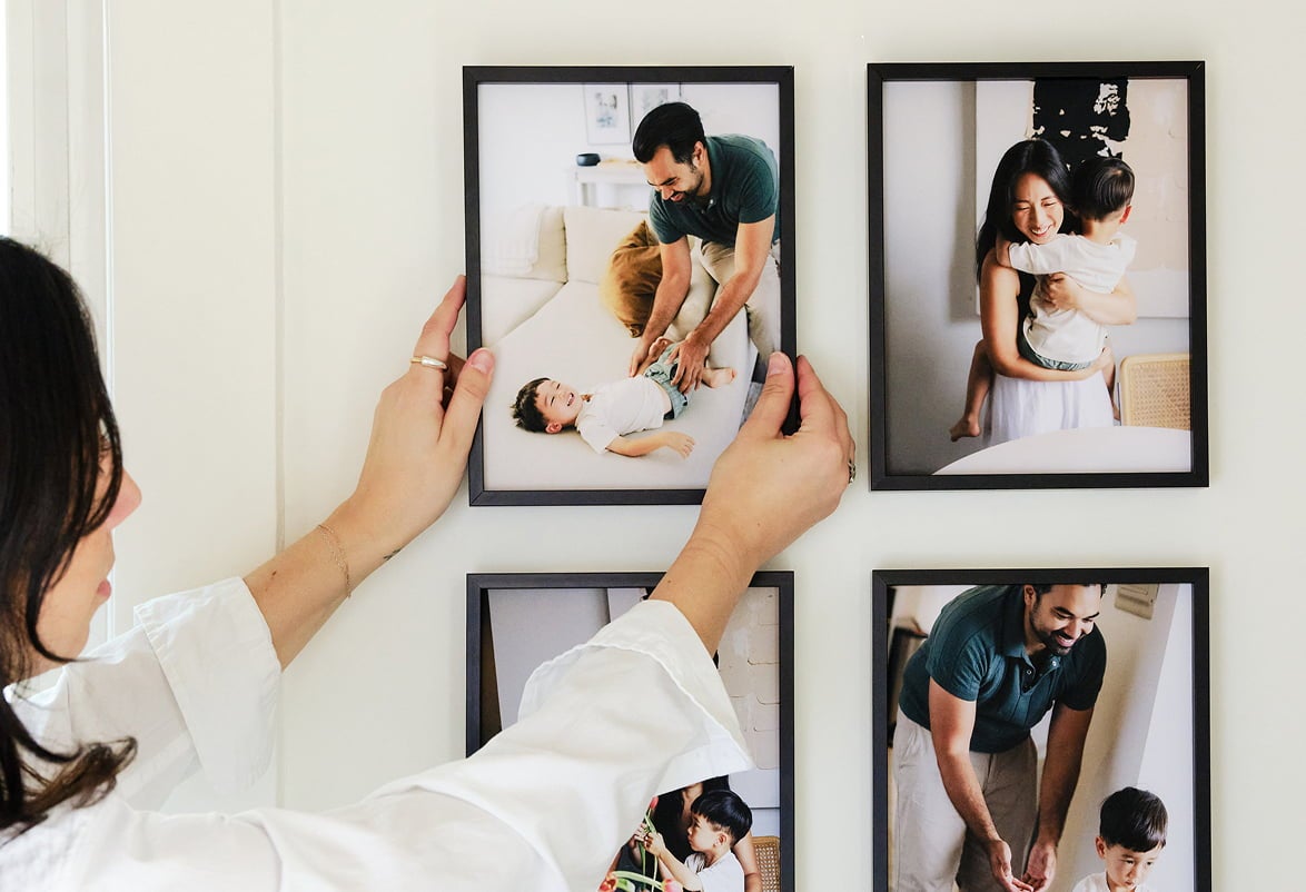 Modern Metal Gallery Wall in Frame finish Black being hung up.
