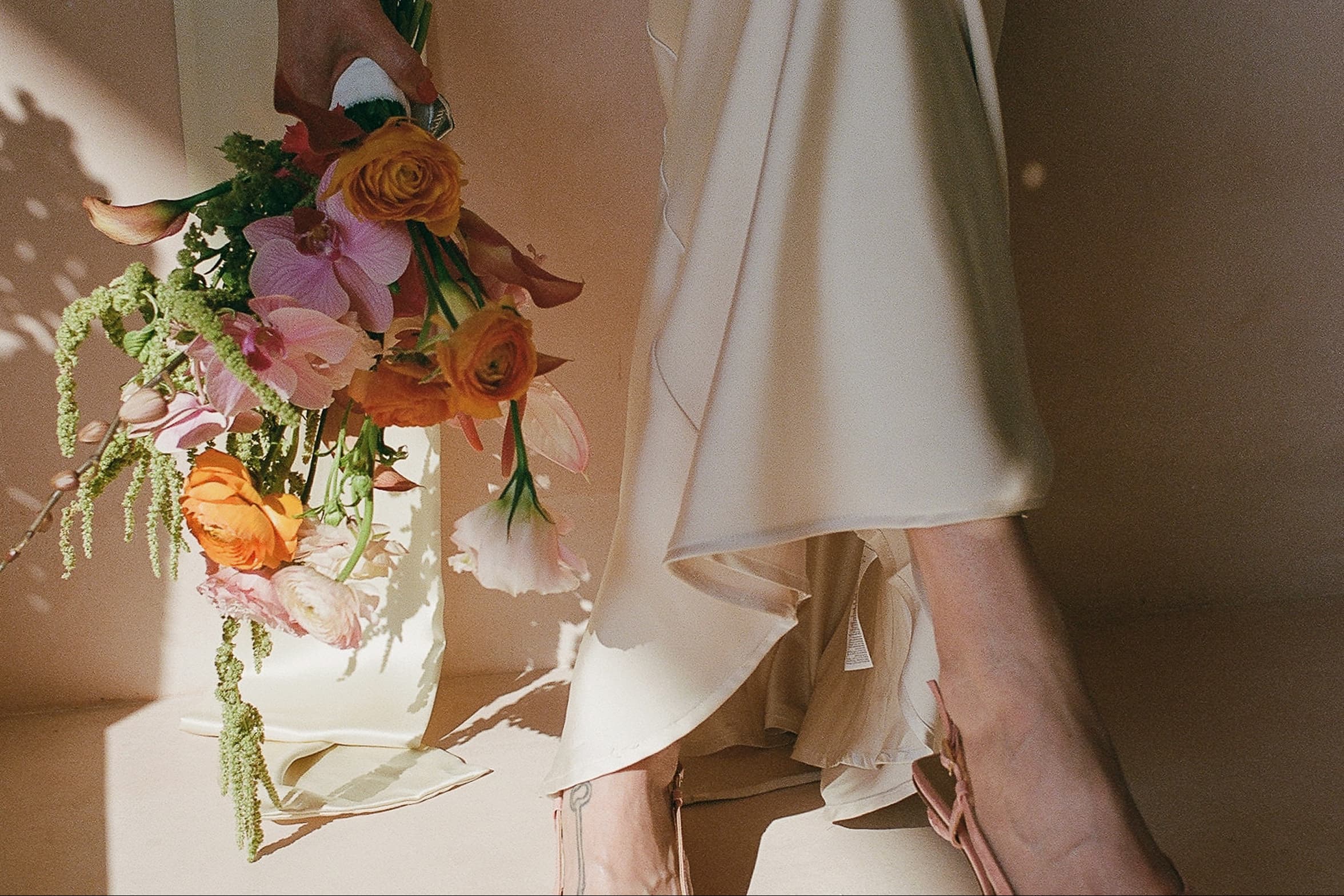 Bride holding a colorful bouquet