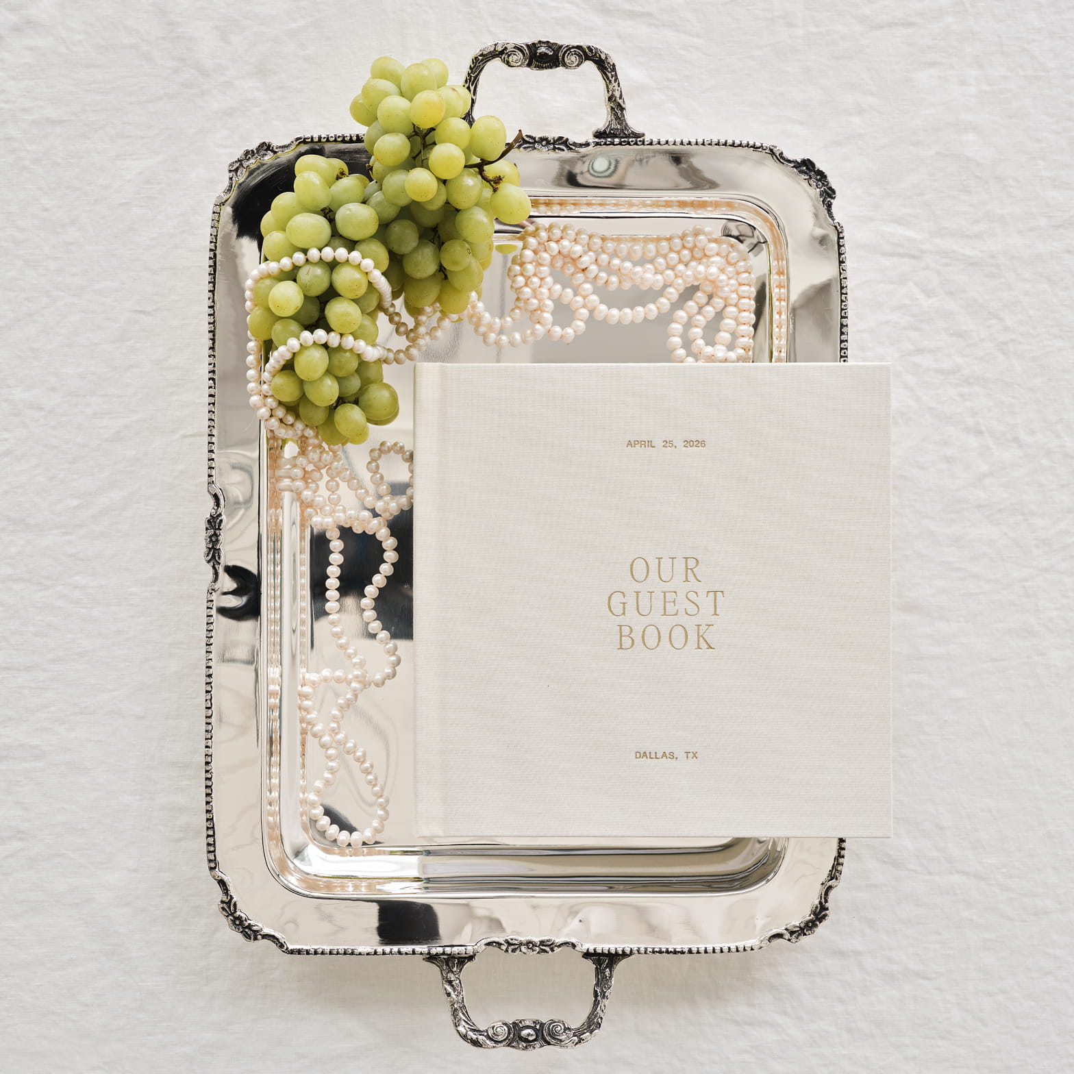 Heritage wedding guest book styled on a silver tray