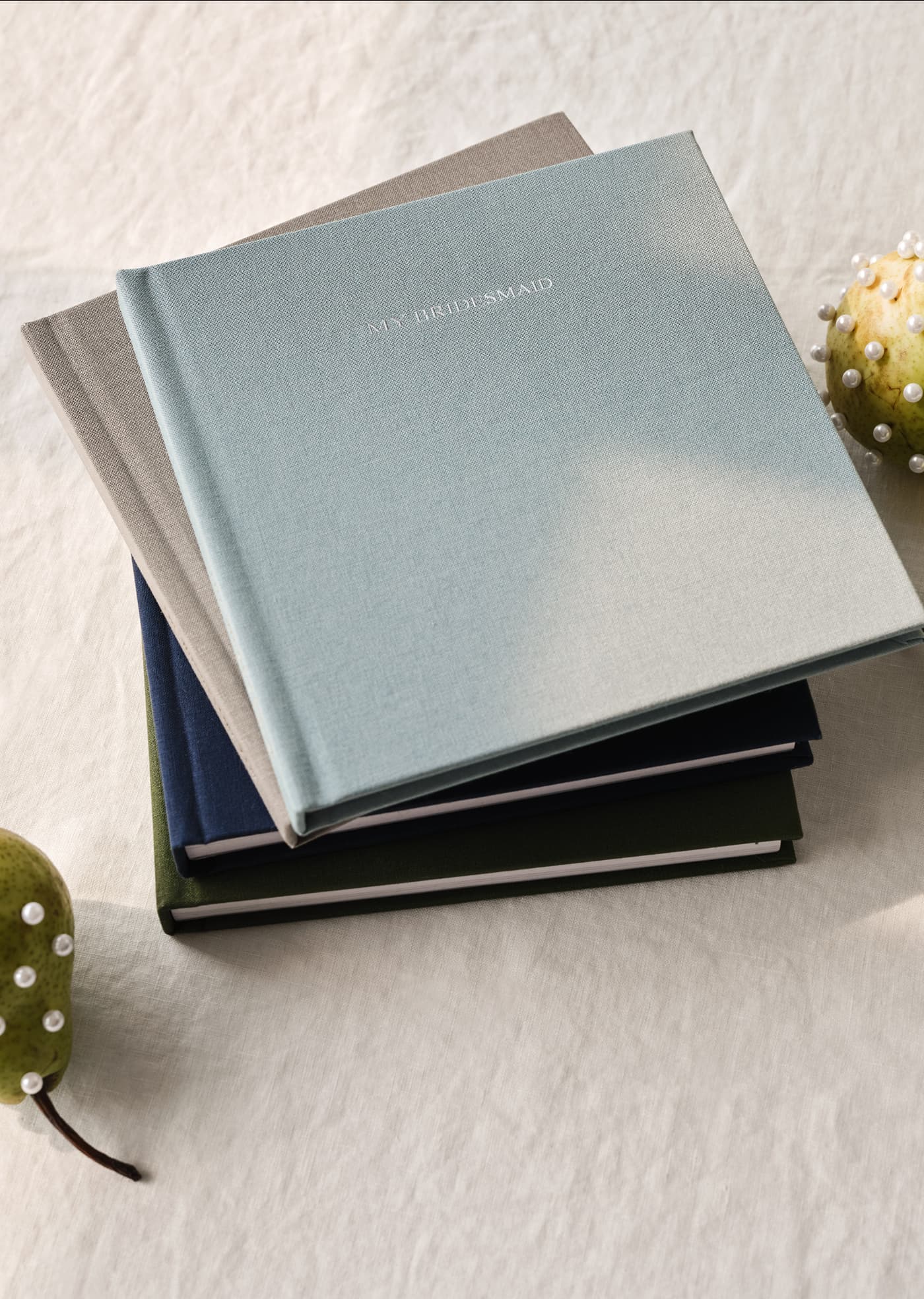 Stack of personalized wedding photo albums