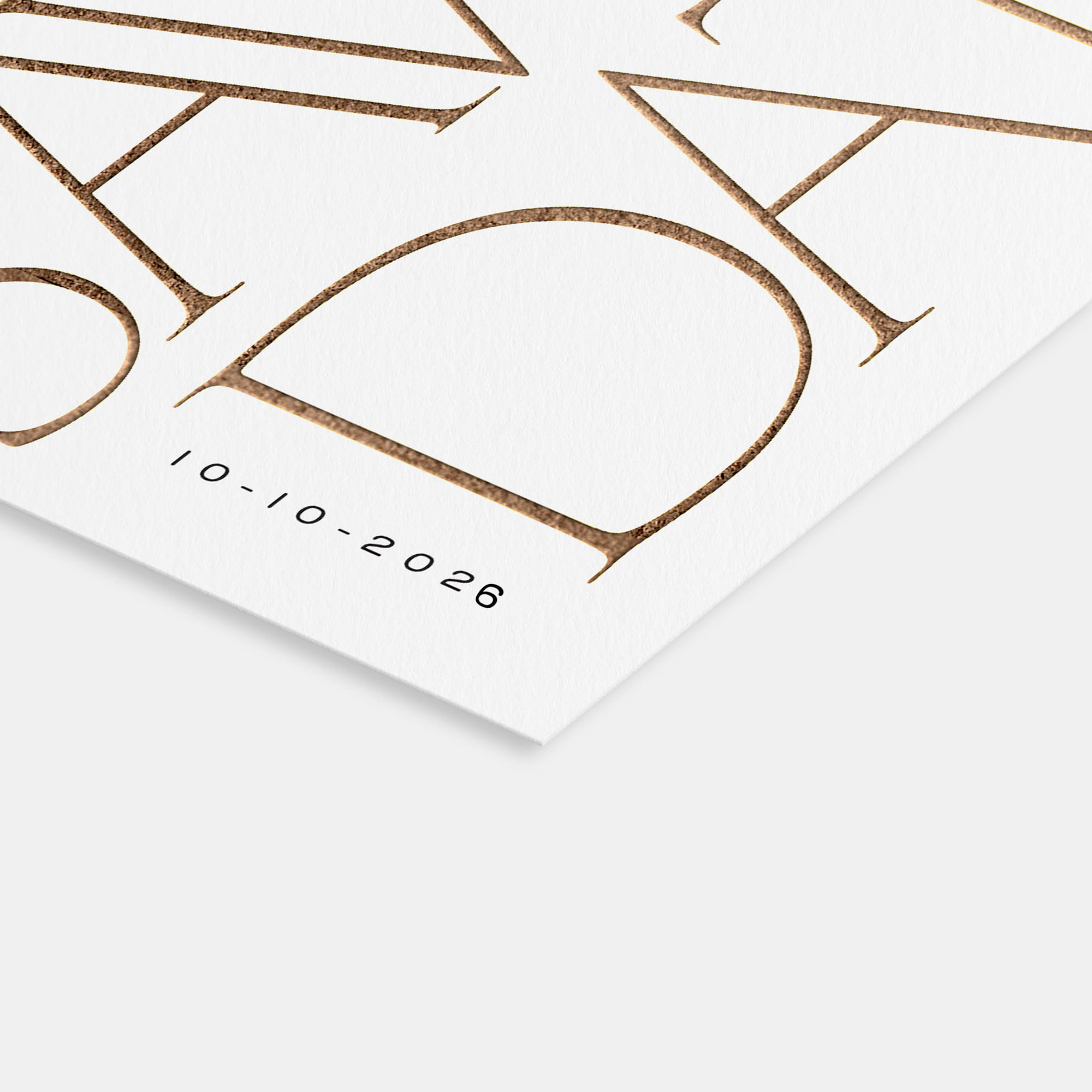 Close-up of a foil Save the Date card