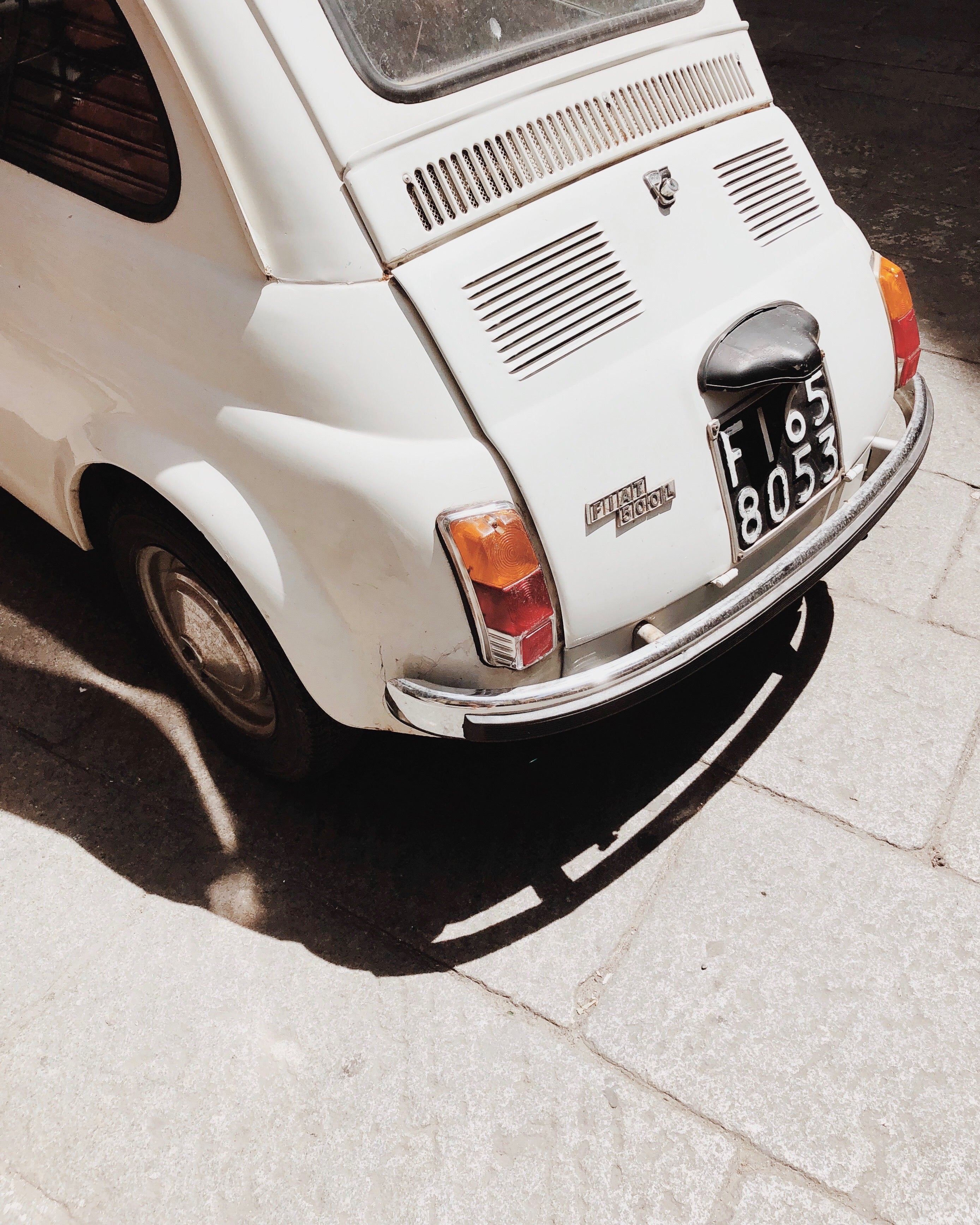 Photo of the back of an old white fiat