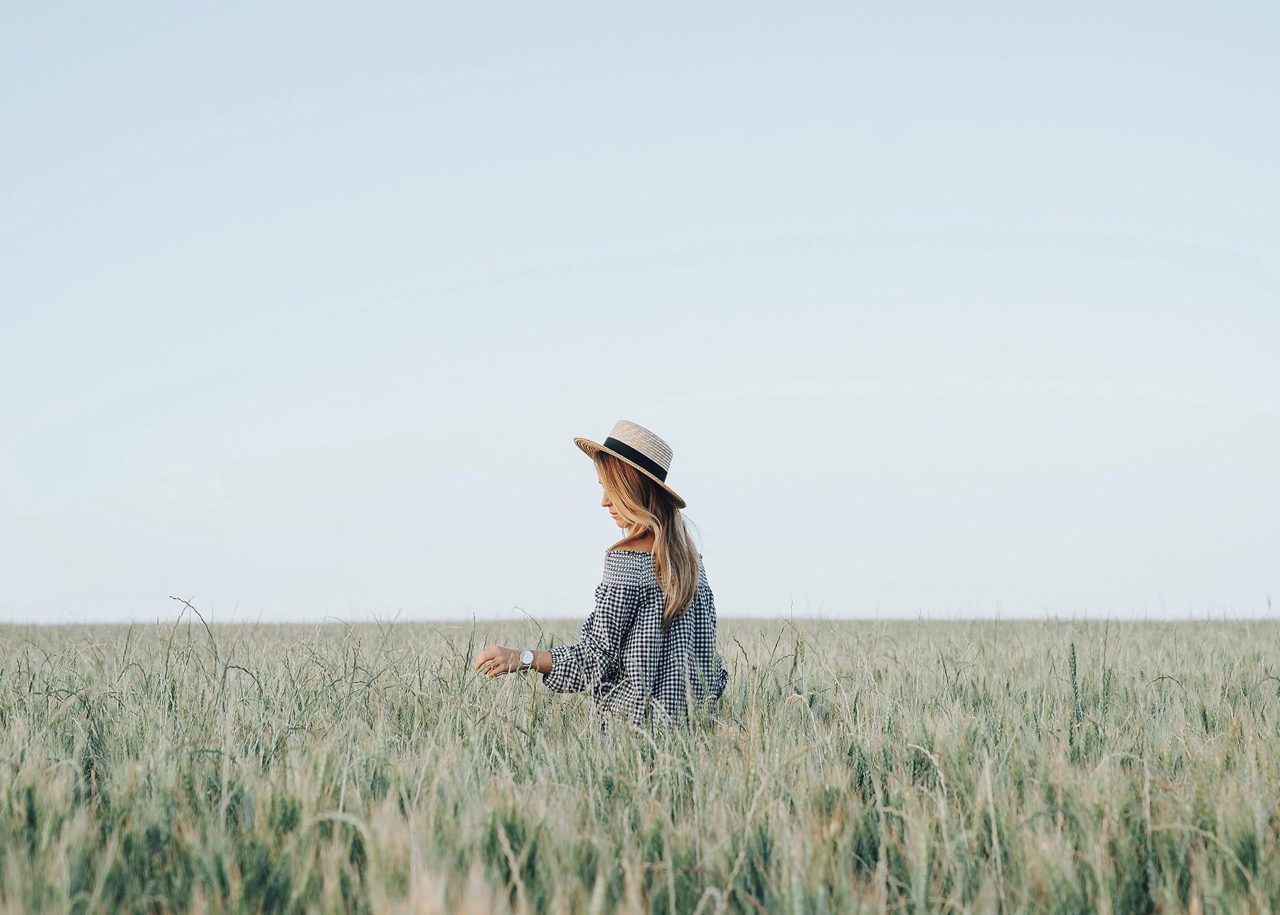 Emilie Ristevski photo of woman walking through wheat field