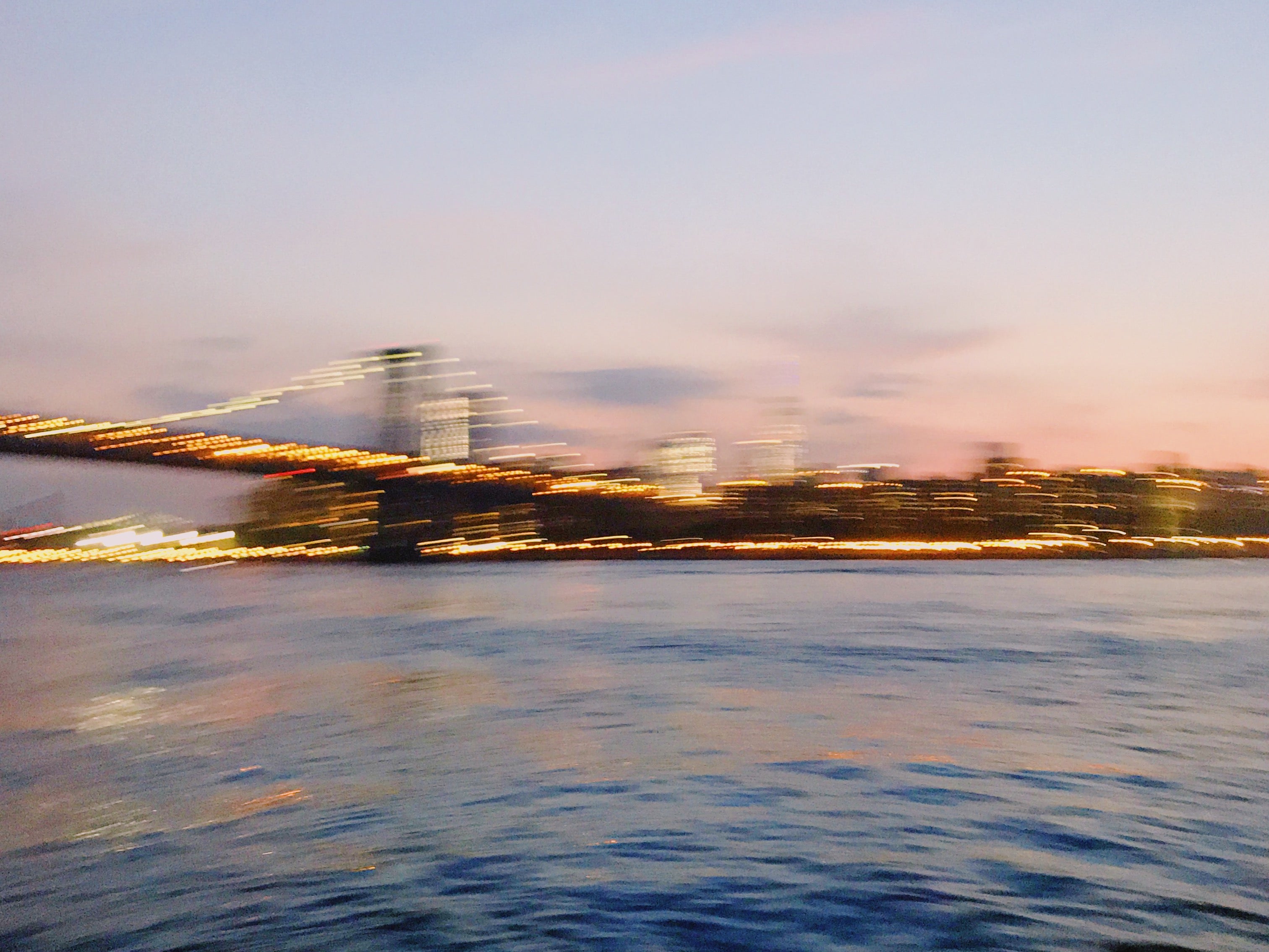 Blurry photo of bridge and city lights