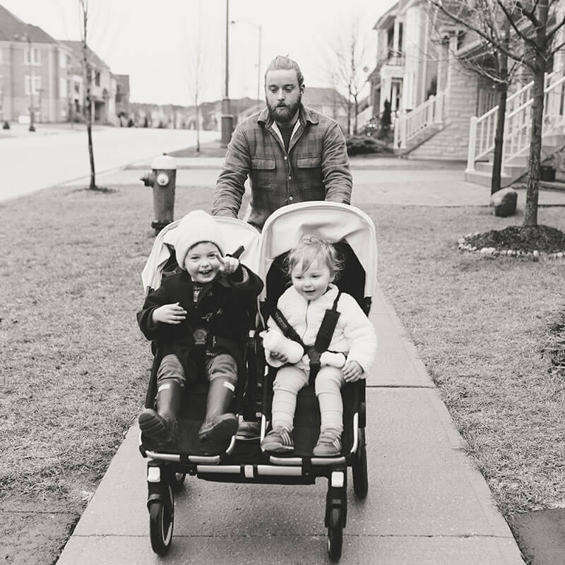 Photo of father pushing double stroller from Father's Day album